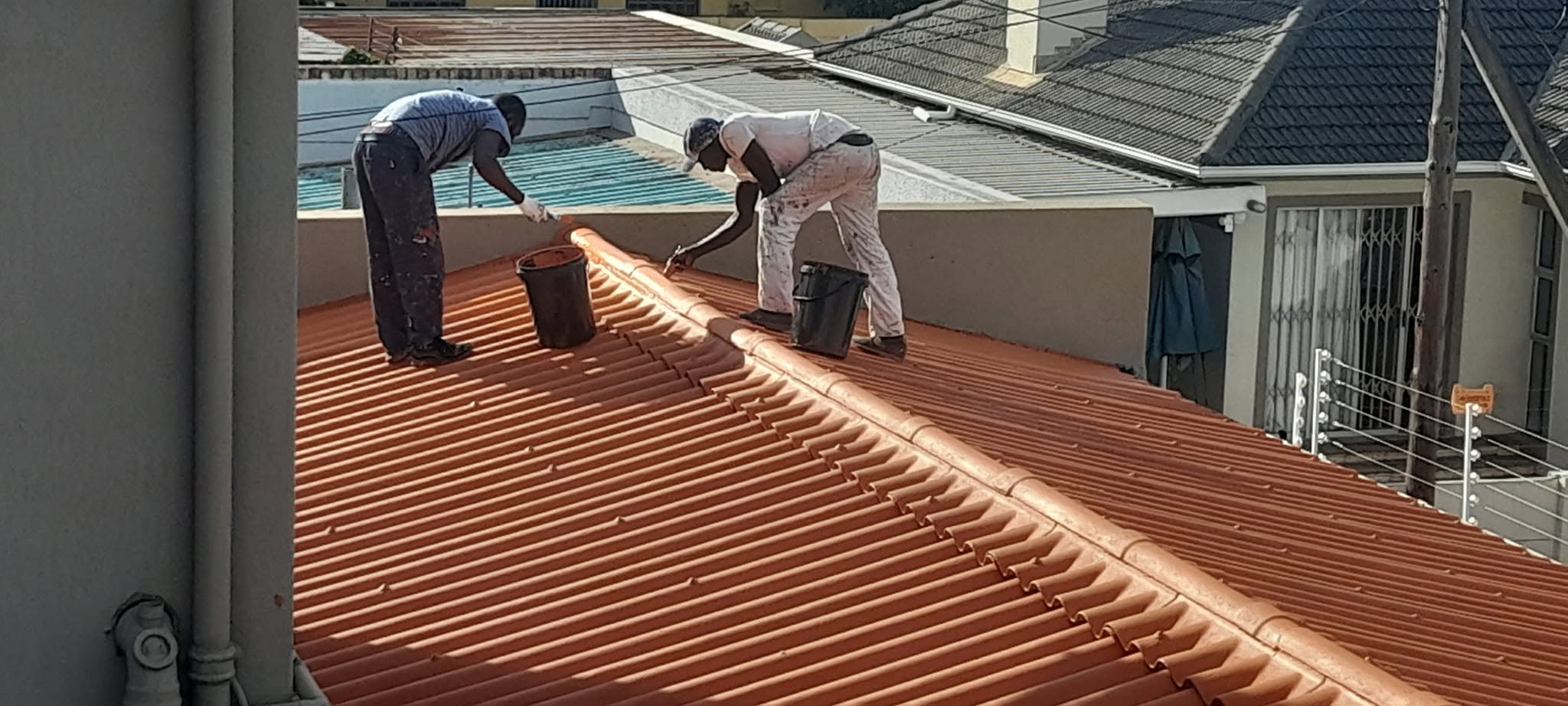 Team coating a tiled roof in Cape Town